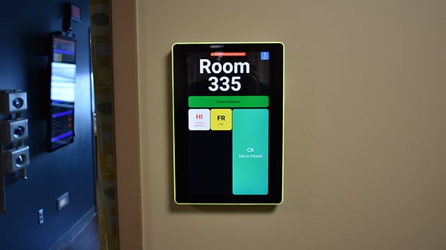 An example of the smart wall sign outside the door of a patient room
