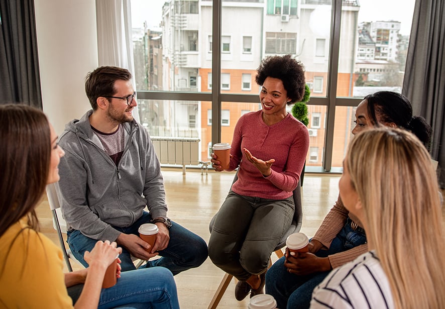 A woman leading a group discussion