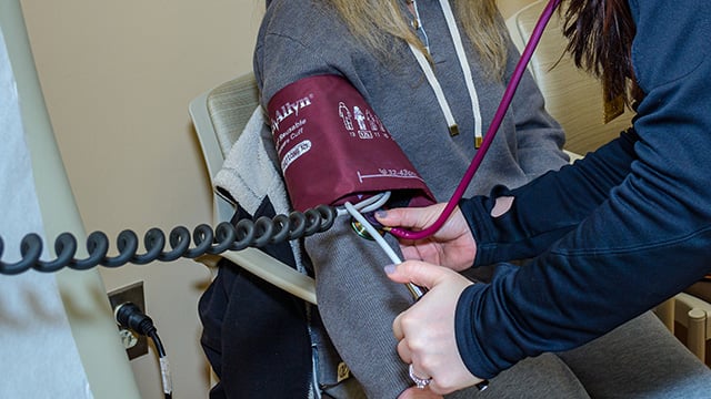 A patient having their blood pressure taken during an office visit.