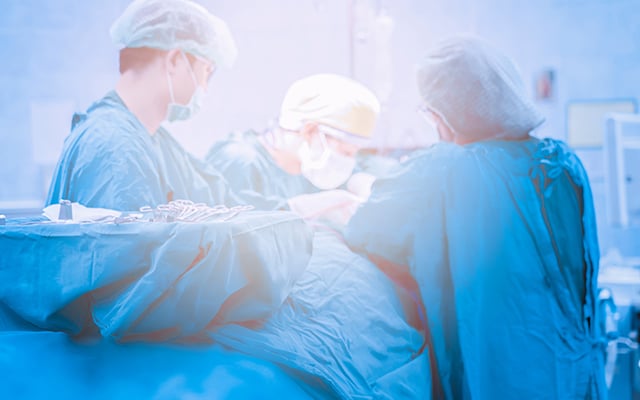 A surgical team performing surgery in the operating room