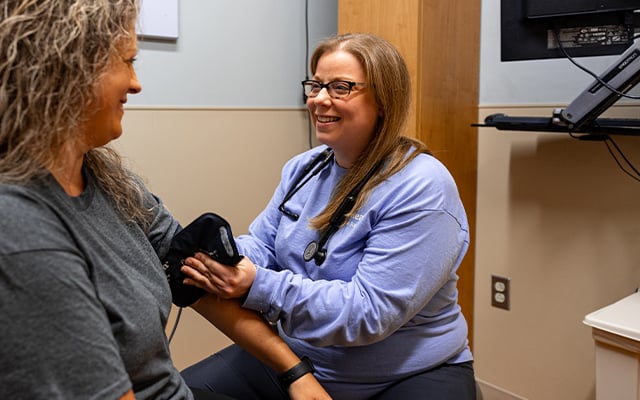 Reid Health's Erin Harris NP, examining a patient at Reid Ready Care Clinic