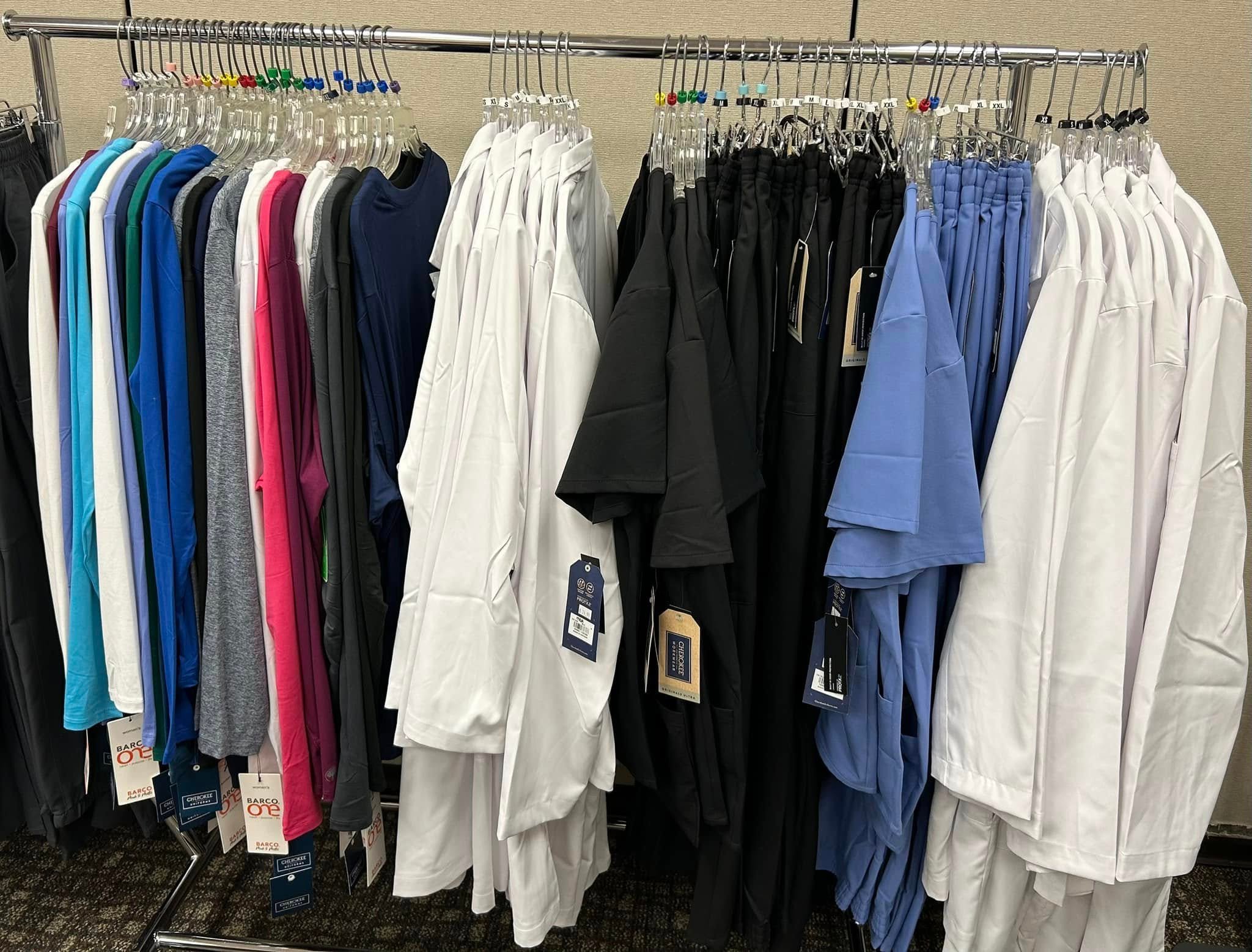 Photo shows uniforms, lab coats, and scrubs that are available at DASCO Reid Uniform & Shoes