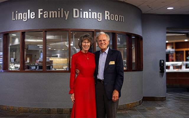 Paul and Pat Lingle posing in front of the Lingle Family Dining Room