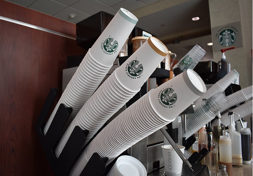 An image of the espresso bar showing Starbucks cups