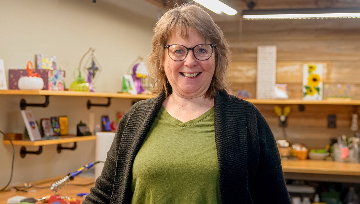Mary Burk of Franklin, IN smiling in her workshop