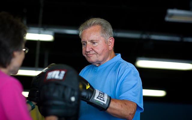 Rock Steady Boxing participant Richard Ross boxing during a class.