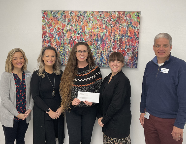 Firefly Children & Family Alliance is presented with a grant from Reid Health Community Benefit