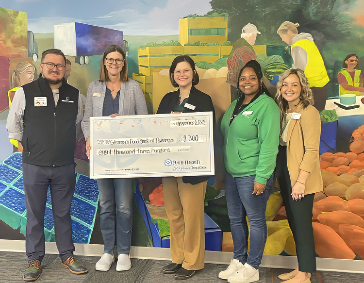 Reid Health Community Health presenting a check to Gleaners Food Bank of Indiana