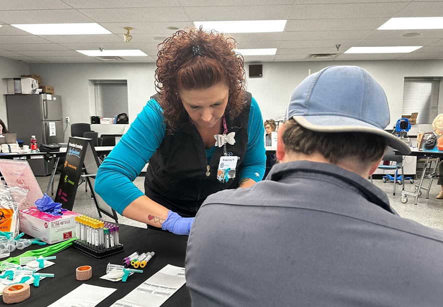 Photo is of a health fair conducted by Reid Health Employer Solutions for a business partner