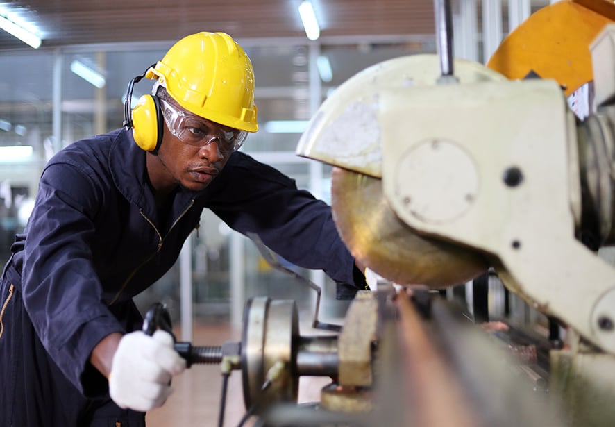 A man in an industrial setting  working