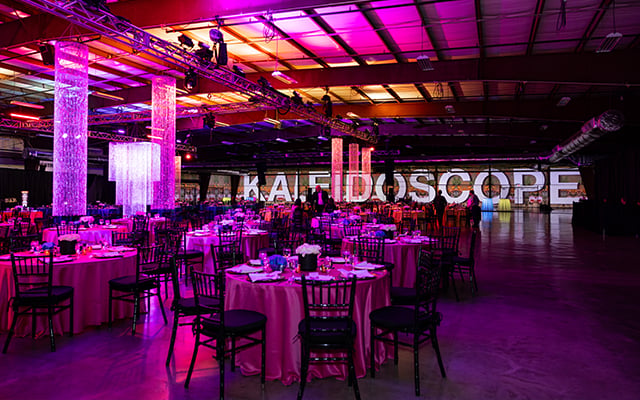 A image showing the word Kaleidoscope in the background and the sitting area before guest arrivied.