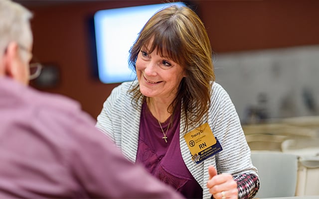 A Reid Health nurses interacting with a patient 