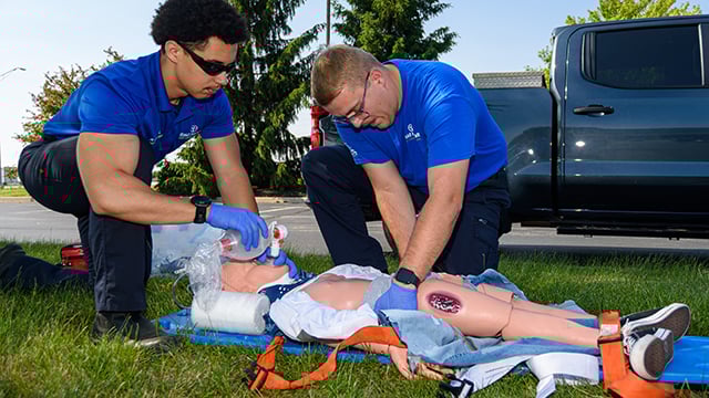 Two EMS trainees working in drowning simulator situation 