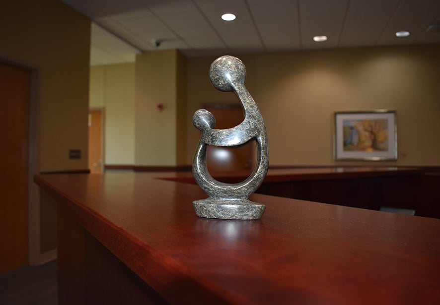 An image of the The Healer's Touch sculpture the Daisy winner receives 