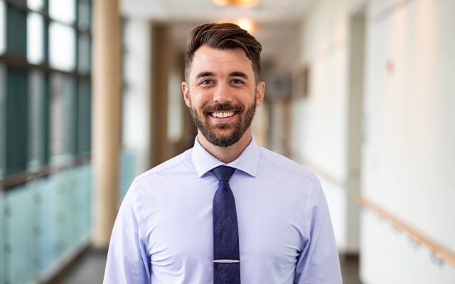 A professional headshot of Reid Health's Brandon Guth, PA