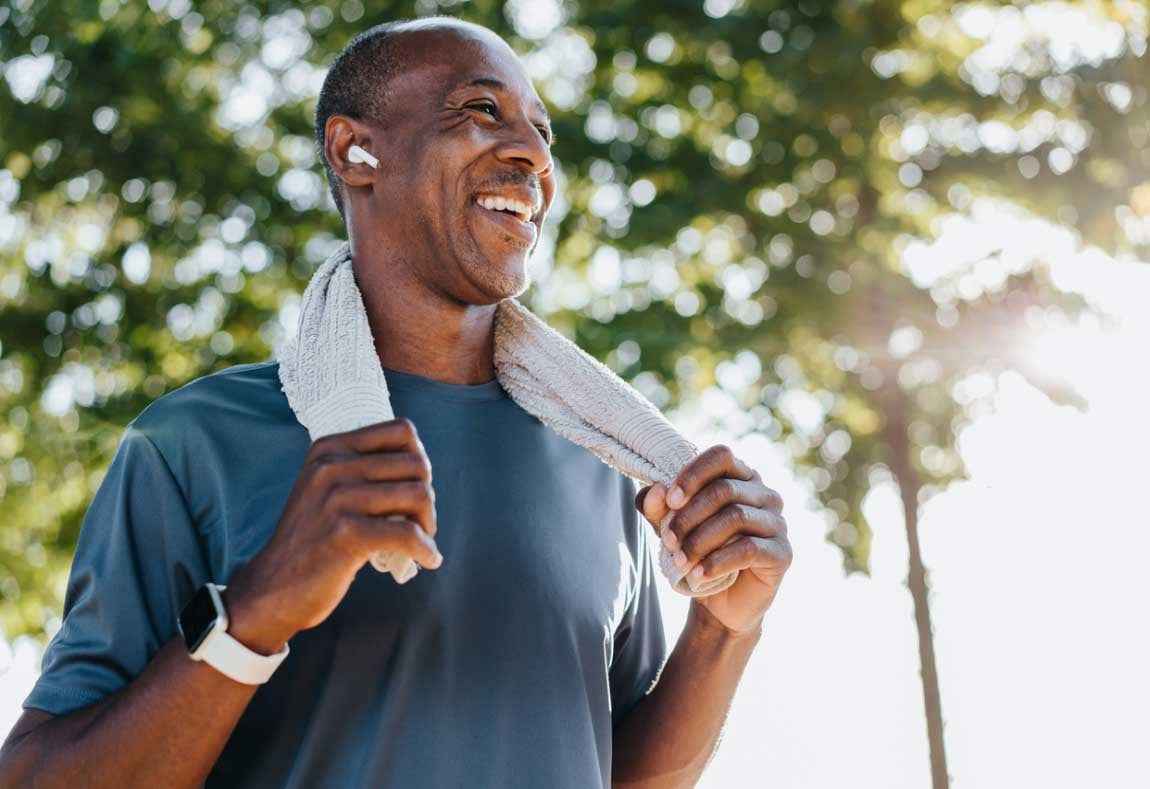 man outside running in the summer