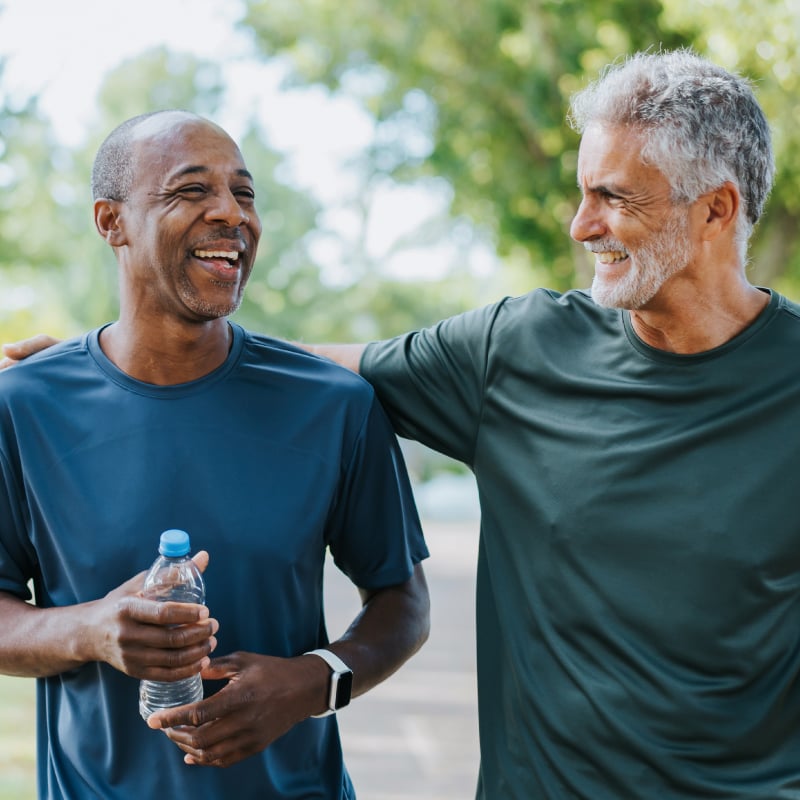 Two smiling men out for a walk