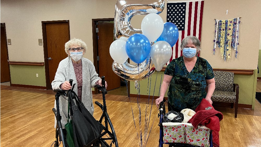 Two residents in Newark gather to celebrate the 5 year anniversary of ElderONE Silver Hill