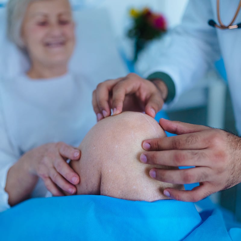 An older white woman recovering from knee surgery