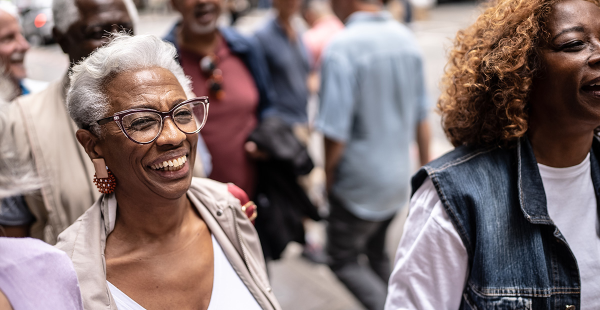 Seniors smiling and walking in a downtown area