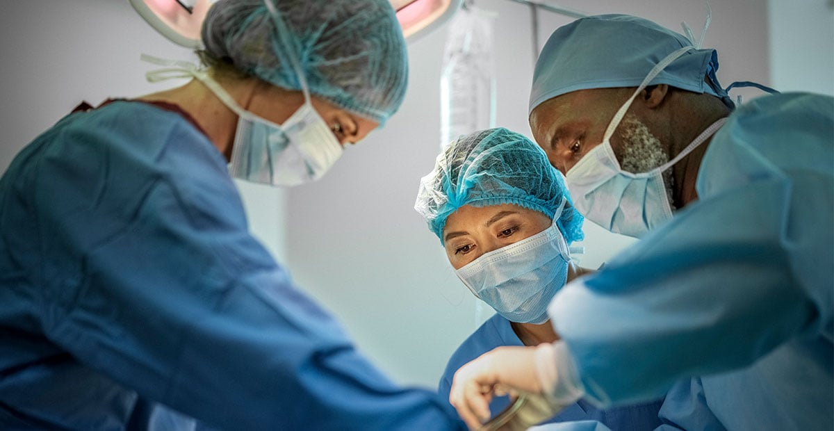 Three surgeons in an operating room
