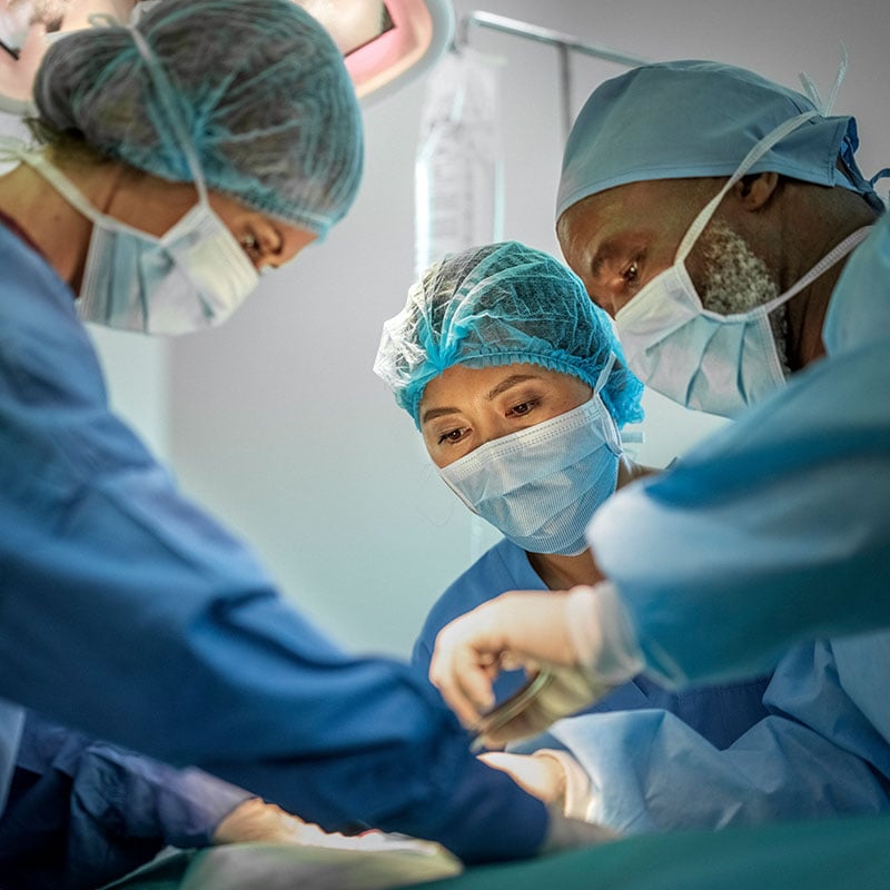 Three surgeons in an operating room