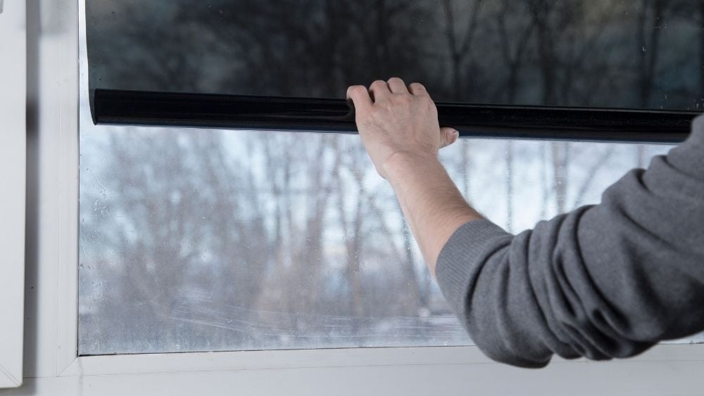 Person closing or opening a window