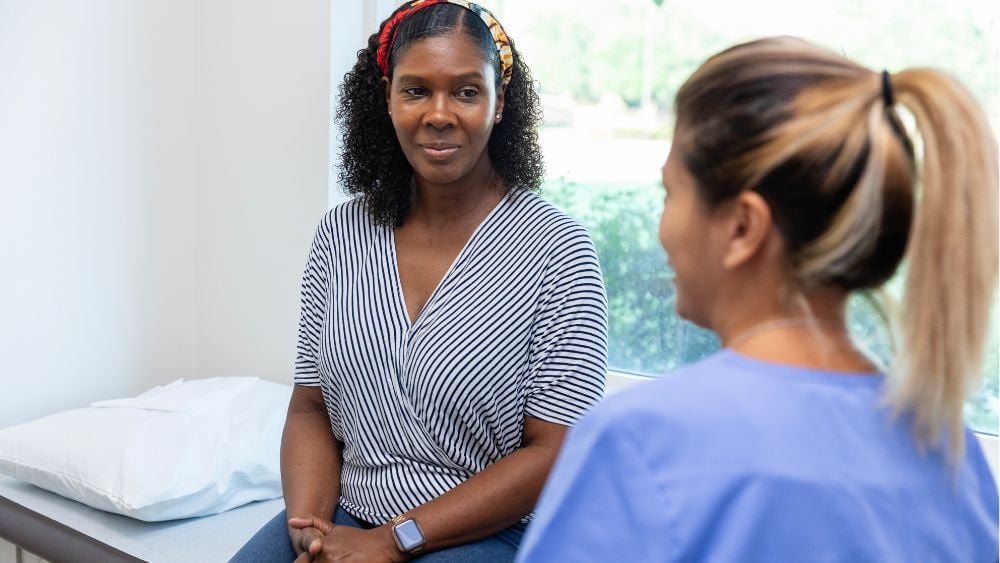 Female patient talking with gynecologist