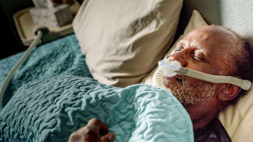 Man wearing CPAP for sleep apnea