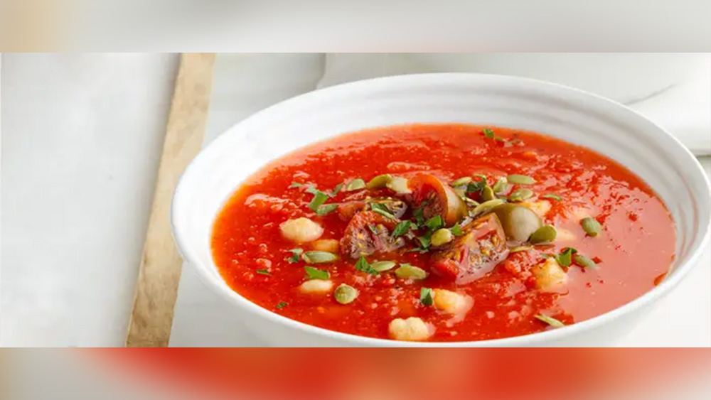 Red soup in white bowl