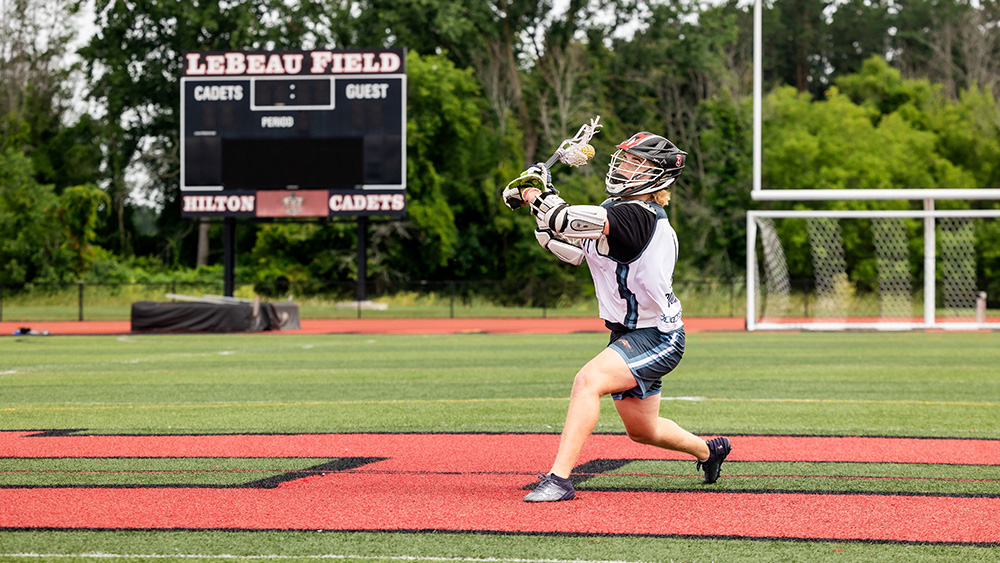 Teenager playing lacrosse