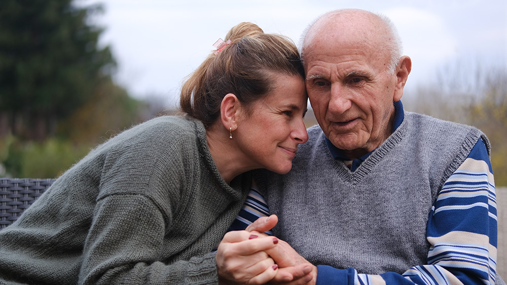 Adult daughter and elderly father