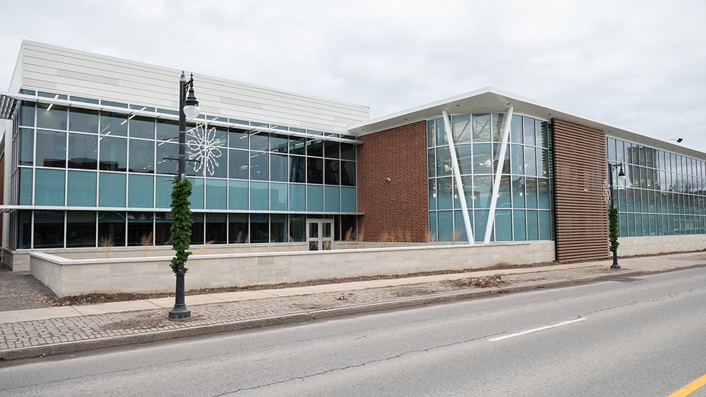 Exterior of newly constructed healthy living building with cloudy skies