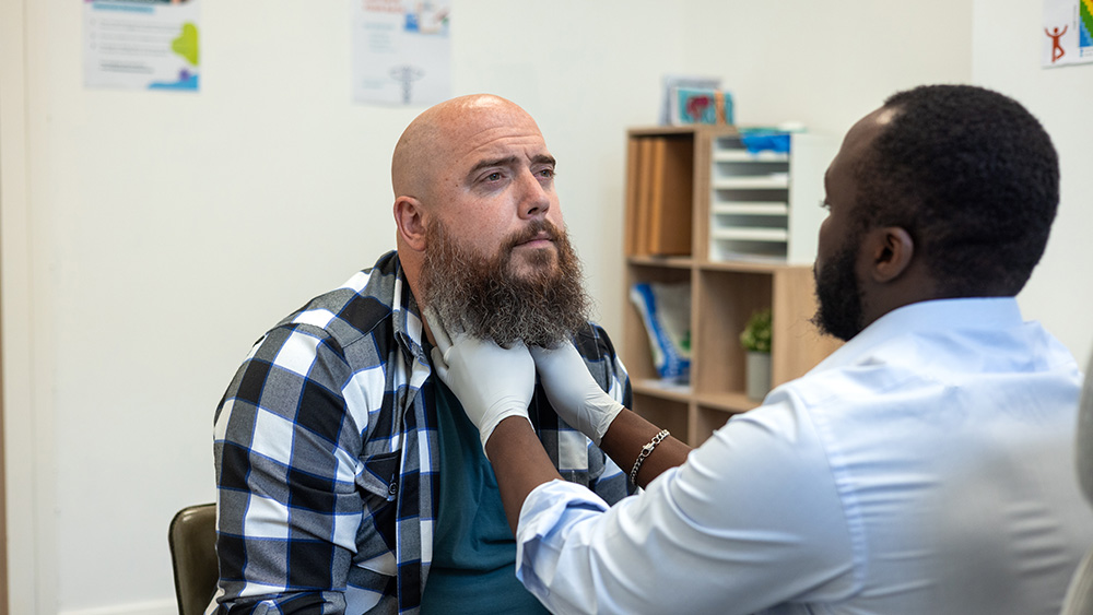 Man examined by head and neck cancer doctor