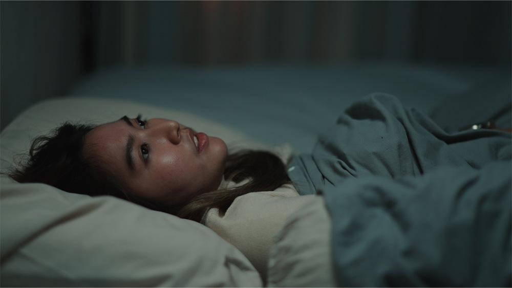 Young asian woman insomnia in bedroom at night