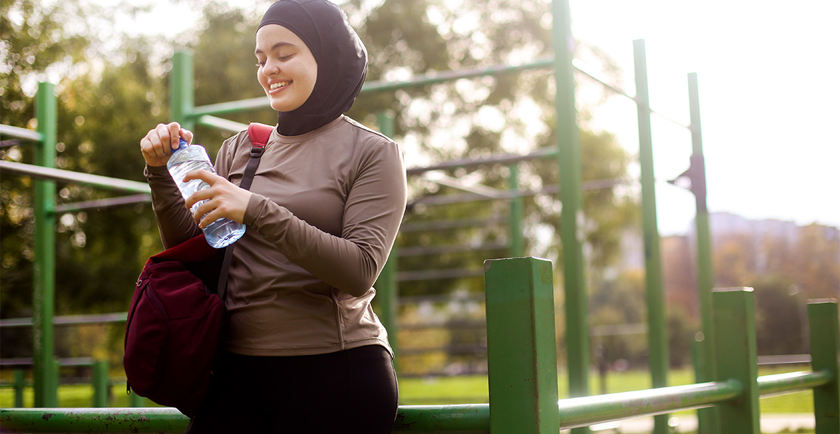 Middle-eastern female exercising in a park. About 25 years old, Arab woman