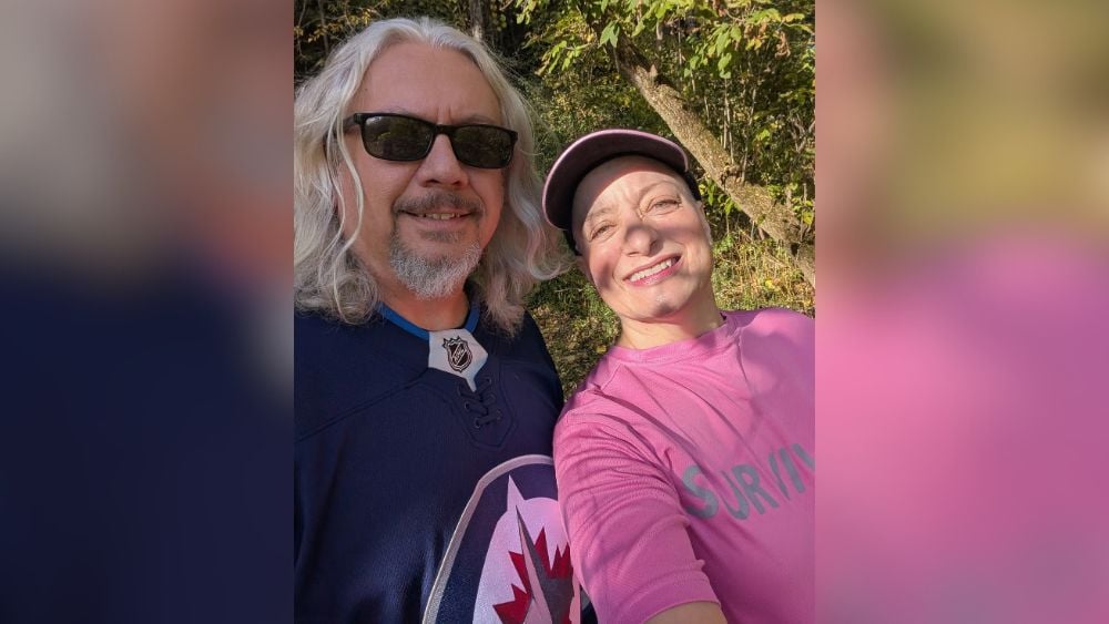 Stephen and Janis Becker walking together outside