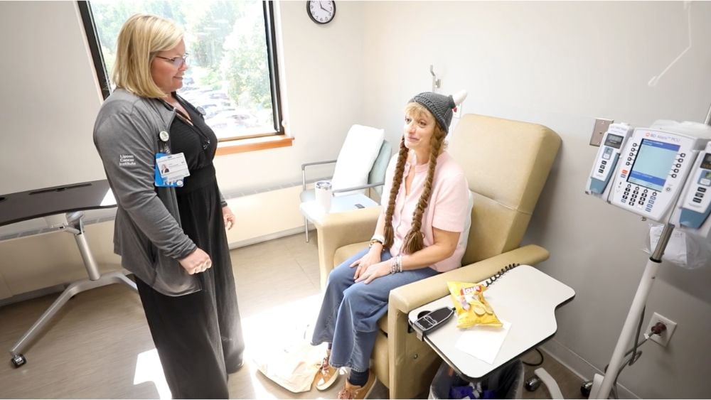 Janis Becker at her final chemotherapy treatment wearing a Viking hat