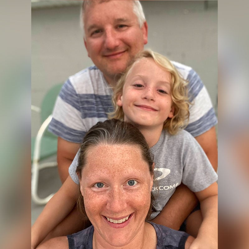 Jolene, her son, and her husband at the St. Lawrence River in 2021