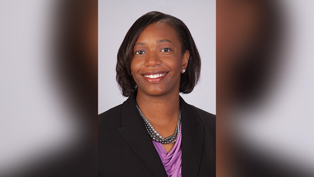 Female Black doctor smiling