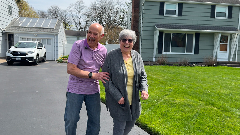 Joe and Marlene walking and smiling