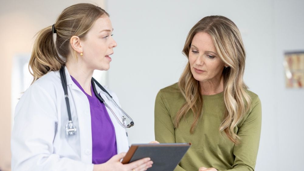 Breast cancer doctor talking with breast cancer patient