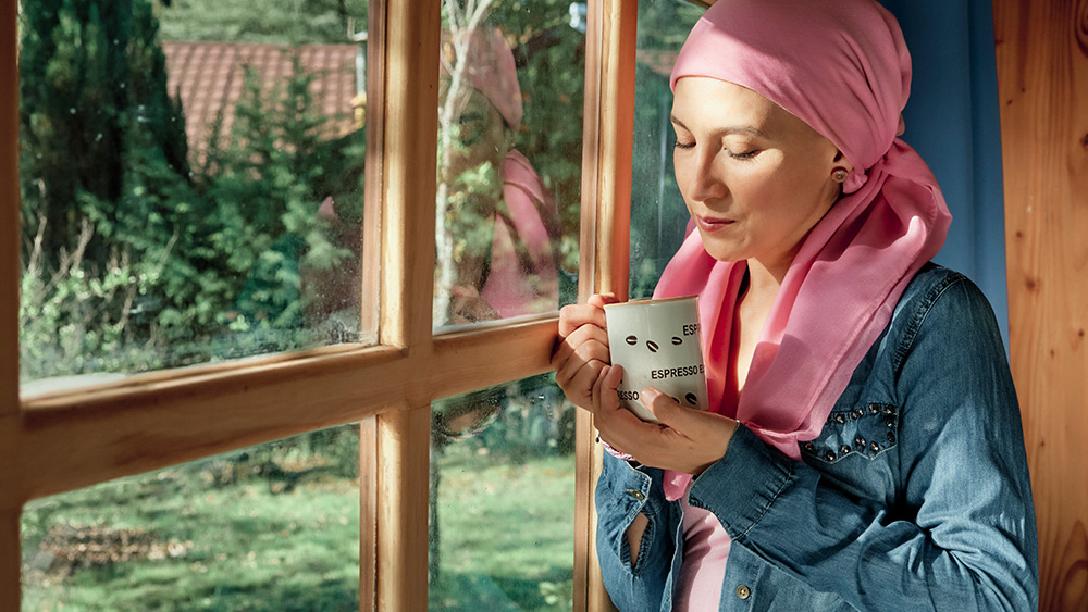 Breast cancer patient looks out window