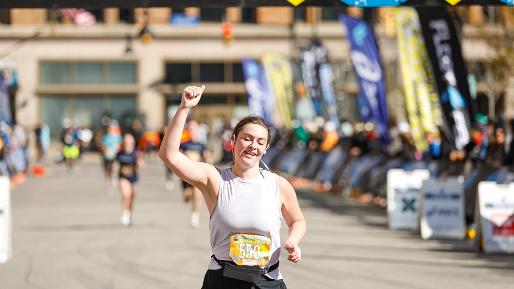 Female runner finishing half marathon race