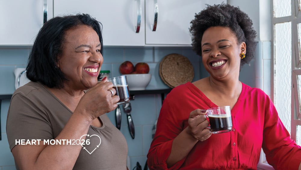 Two African American woman drinking coffee