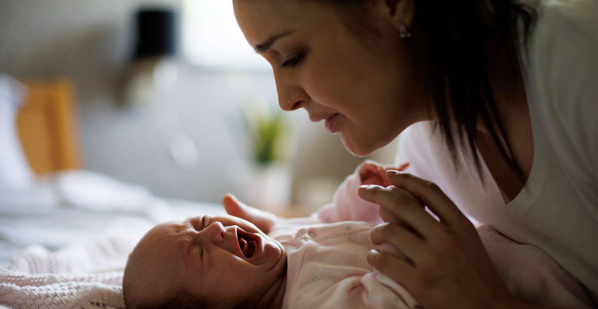 Mother and crying newborn baby