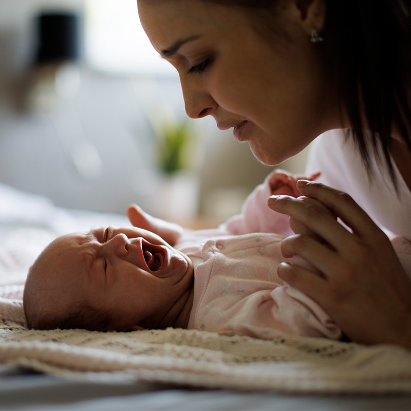 Mother and crying newborn baby