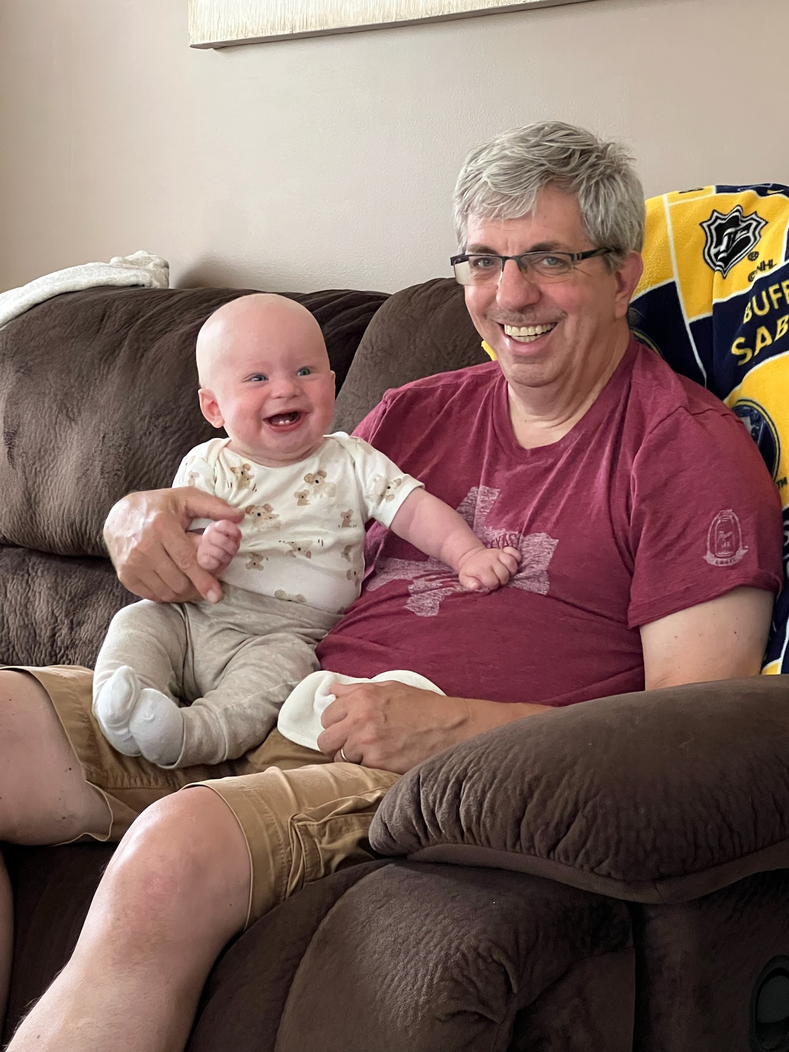 David Priolo and his grandchild following his surgery
