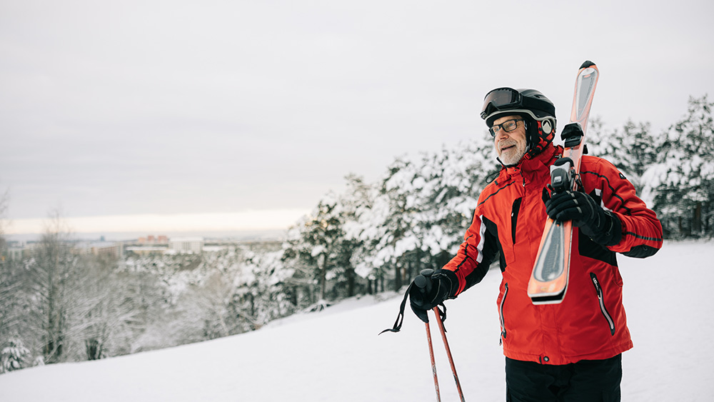 Man with skis on mountain