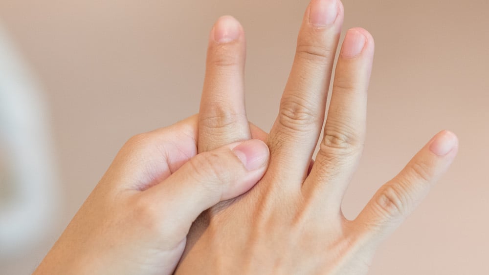 Person holding up fingers